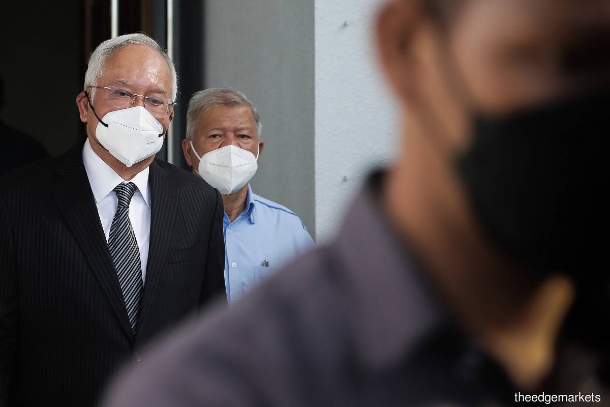 In the 1MDB audit report tampering trial, Najib (left) is charged with abusing his power to amend the report before it was submitted to the Public Accounts Committee to protect himself from disciplinary, civil and criminal actions. Also charged is Arul Kanda for abetting Najib. (Photo by Zahid Izzani Mohd Said/The Edge)